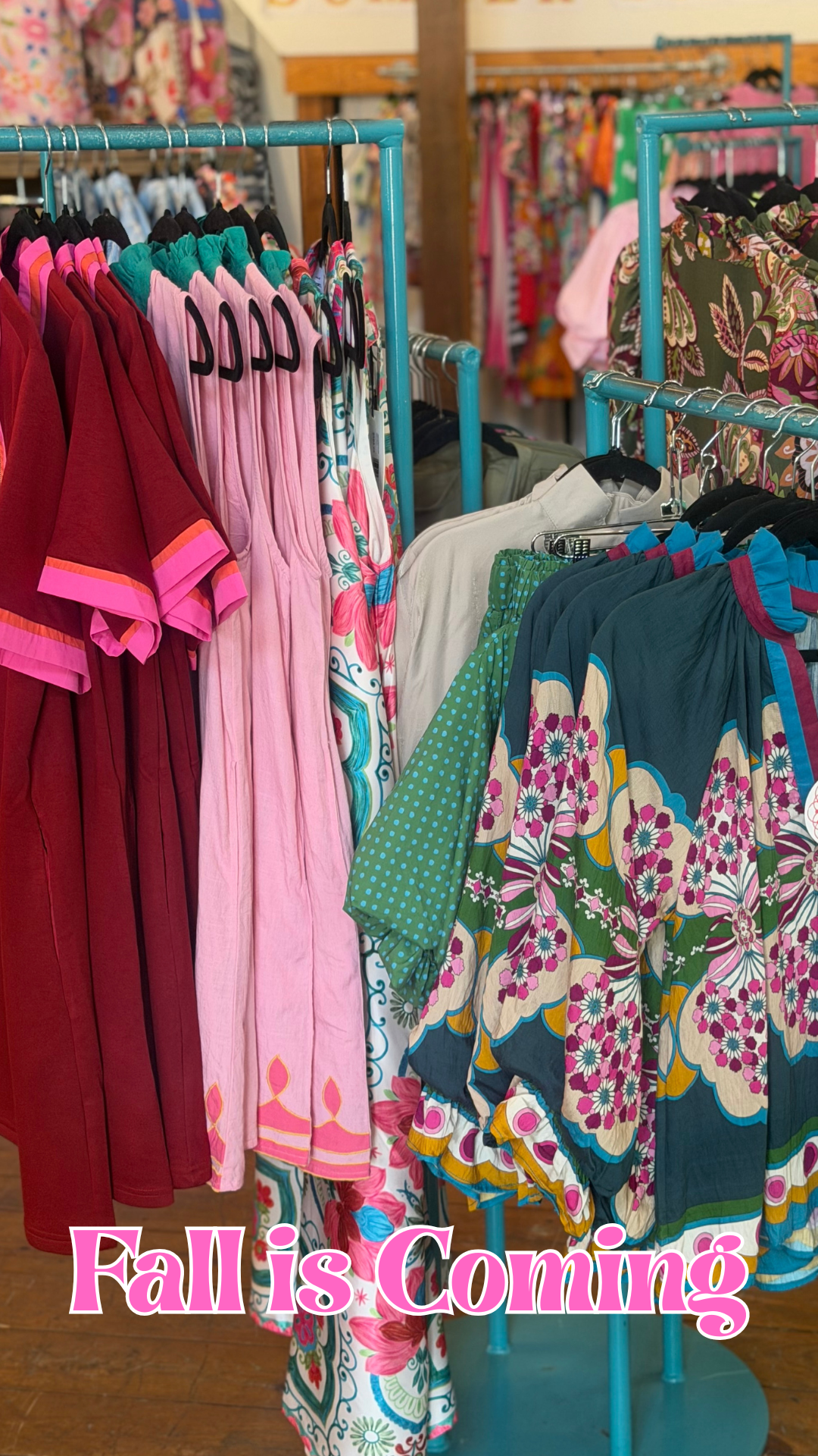 fall tops and dresses on a rack